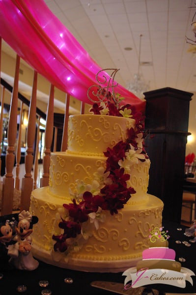 (1011) Variety of Scrolls Wedding Cake with Floral Cascade