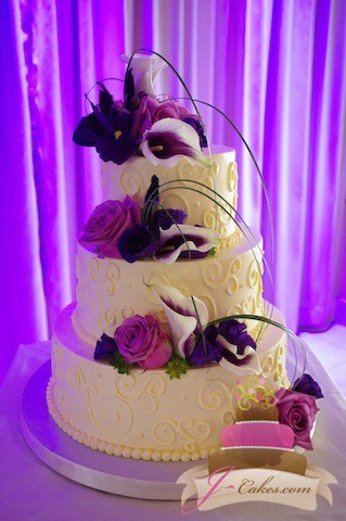 (1035) Variety of Scrolls Wedding Cake with Looped Bear Grass